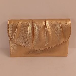 Metallic gold and gold is the inside. 6 length and 9 width  clutche SPD P